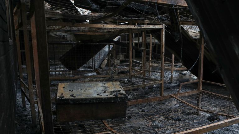 A dormitory destroyed by fire is seen inside the school. Pic: AP