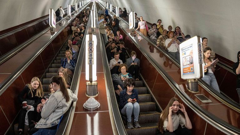 People hide in a metro station during a Russian rocket attack in Kyiv
