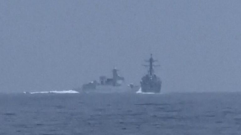 Moment when a Chinese warship sails across path of American destroyer