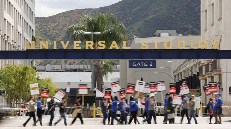 Workers and supporters of the Writers Guild of America protest outside Universal Studios Hollywood after union negotiators called a strike for film and television writers, in the Universal City area of Los Angeles, California, U.S., May 3, 2023. REUTERS/Mario Anzuoni