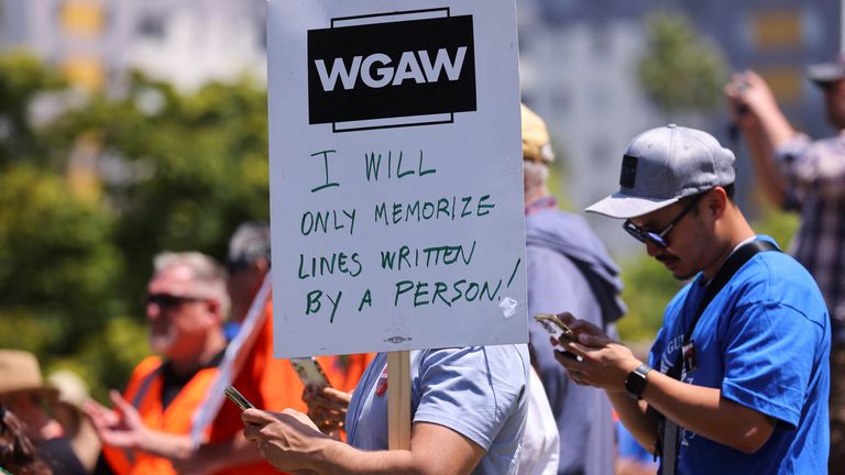 People attend a demonstration held by the Writers Guild of America as the film and TV writers&#39; strike continues, in Los Angeles, California, U.S., June 21, 2023.   REUTERS/Mike Blake