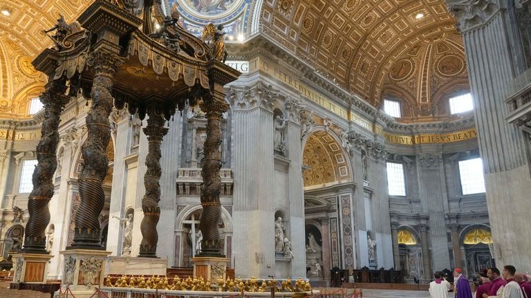 Cardinal Mauro Bassetti, right, celebrates a penitential rite in front of the altar of the confession inside St. Peter&#39;s Basilica, Saturday, June 3, 2023. (AP Photo/Gregorio Borgia)