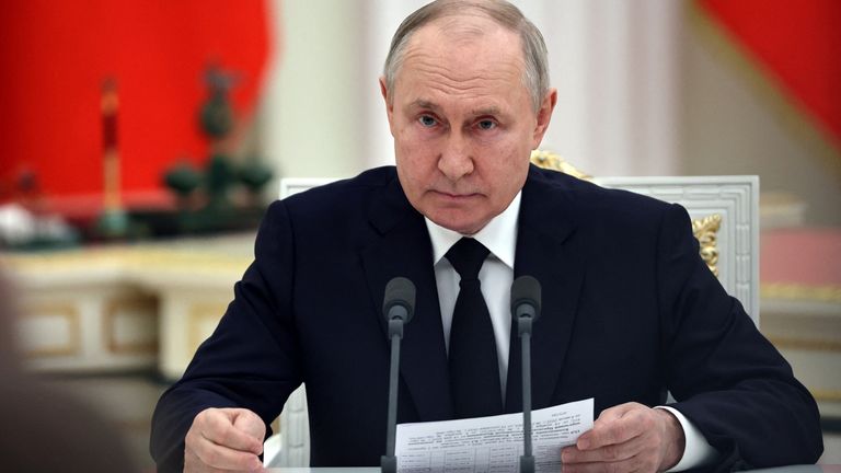 Vladimir Putin attends a meeting with service members at the Kremlin in Moscow, Russia
