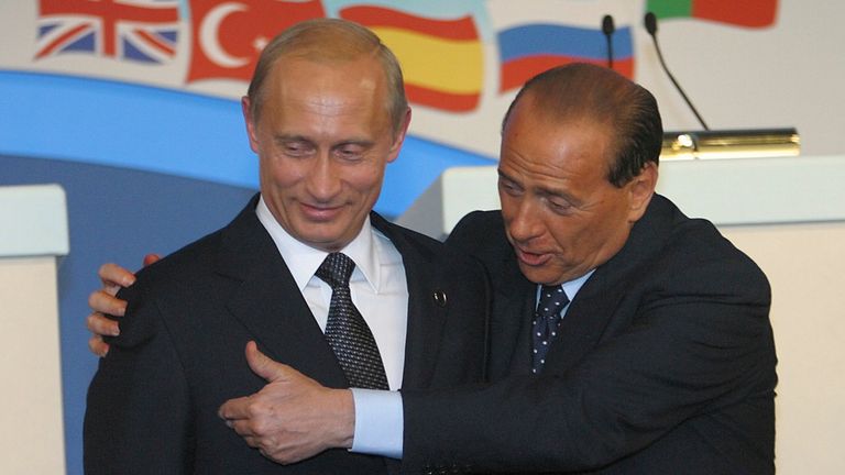 Mr Berlusconi with his friend, Russian President Vladimir Putin, pictured at a NATO summit in 2002 Pic: AP 