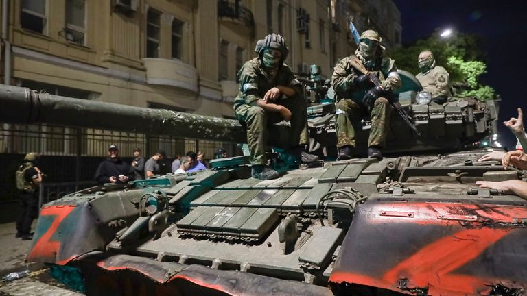 In this image from video, a man sits atop an armored vehicle in the street as residents of the southern Russian city talk with military personnel on Saturday, June 24, 2023. Earlier in the day, the head of the Wagner group, mercenary leader Yevgeny Prigozhin said he had ordered his personnel to halt their march on Moscow to avoid shedding Russian blood. (AP Photo/APTN)