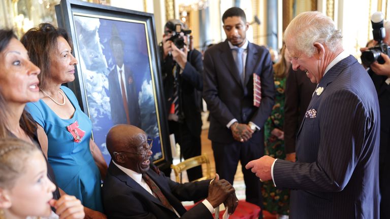 EMBARGOED TO 0001 THURSDAY JUNE 22 Previously unissued photo dated 14/06/23 of King Charles III laughing with Delisser Bernard (seated) during a reception at Buckingham Palace in London, to mark the 75th anniversary of the arrival of HMT Empire Windrush to Tilbury Docks in Essex, on June 22 1948. Issue date: Thursday June 22, 2023.