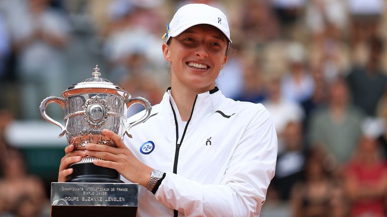 Poland&#39;s Iga Swiatek holds the trophy as she celebrates winning the women&#39;s final match of the French Open tennis tournament against Karolina Muchova of the Czech Republic in three sets, 6-2, 5-7, 6-4, at the Roland Garros stadium in Paris, Saturday, June 10, 2023. (AP Photo/Aurelien Morissard)