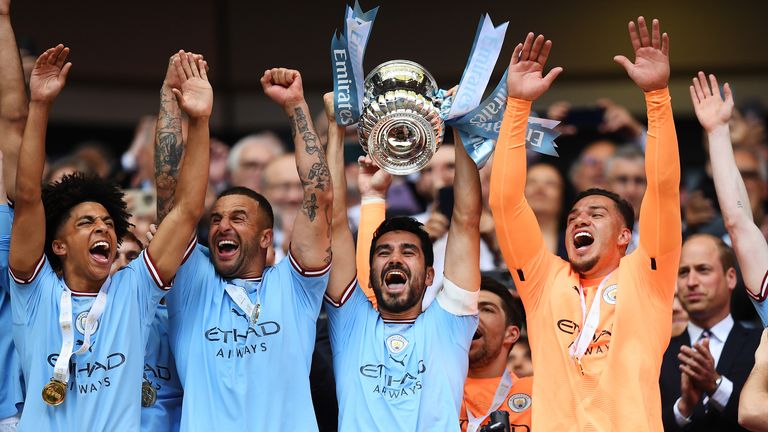 Ilkay Gundogan lifts the FA Cup Trophy after Man City&#39;s 2-1 win over rivals Man Utd