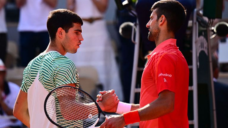 Serbia&#39;s Novak Djokovic (R) shakes hands with Spain&#39;s Carlos Alcaraz Garfia after his victory during their men&#39;s singles semi-final match on day thirteen of the Roland-Garros Open tennis tournament at the Court Philippe-Chatrier in Paris on June 9, 2023. (Photo by Emmanuel DUNAND / AFP) (Photo by EMMANUEL DUNAND/AFP via Getty Images)