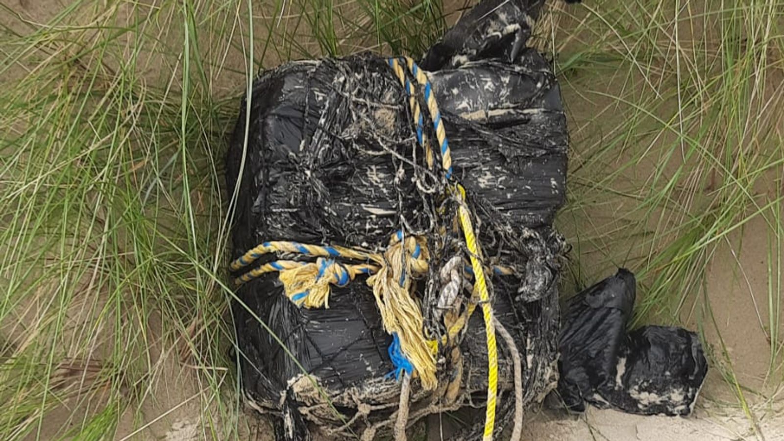 Groups of young people scour Irish beach after large bales of suspected cocaine wash ashore