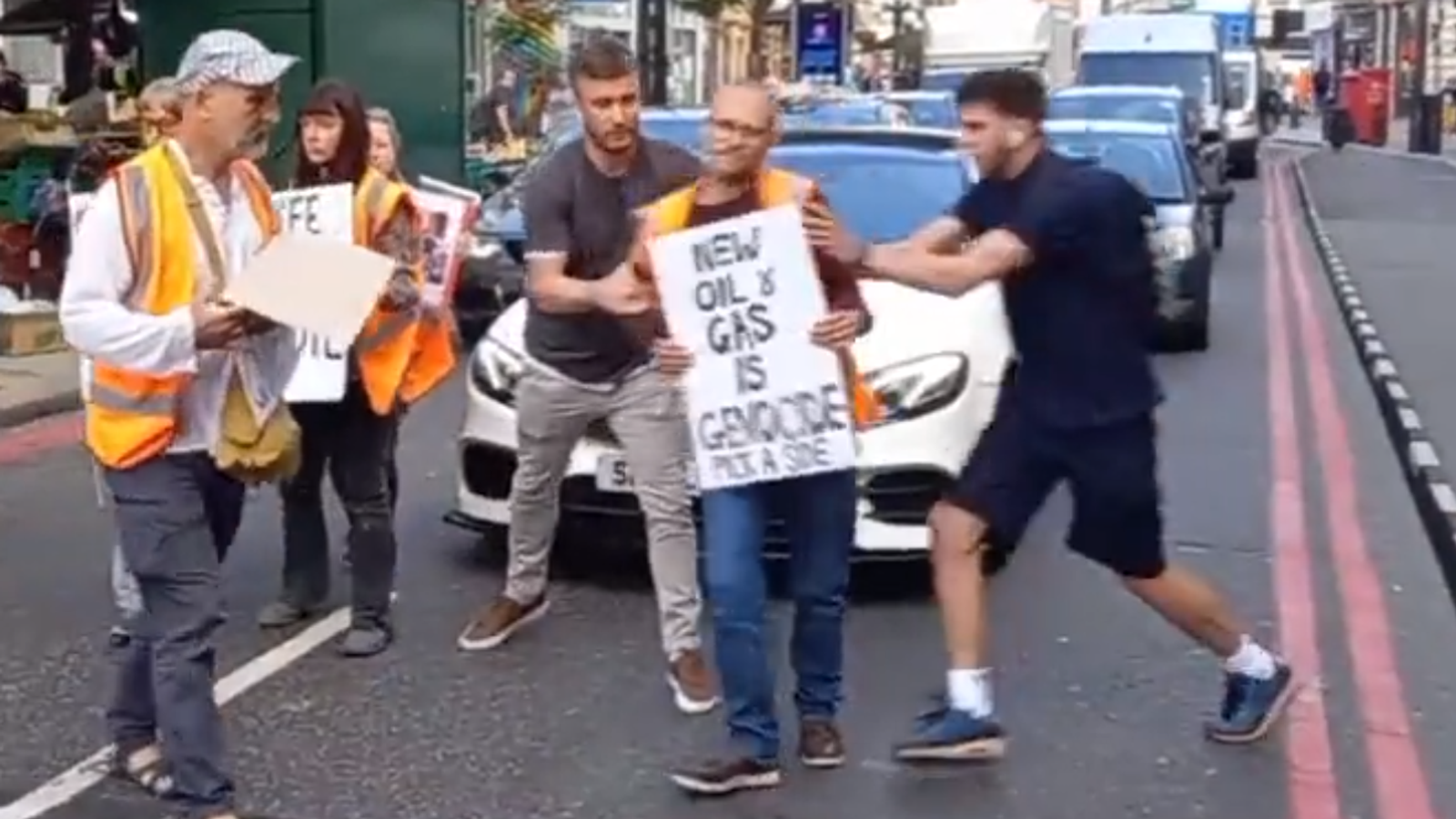 Just Stop Oil protesters shoved off the road during slow march in London