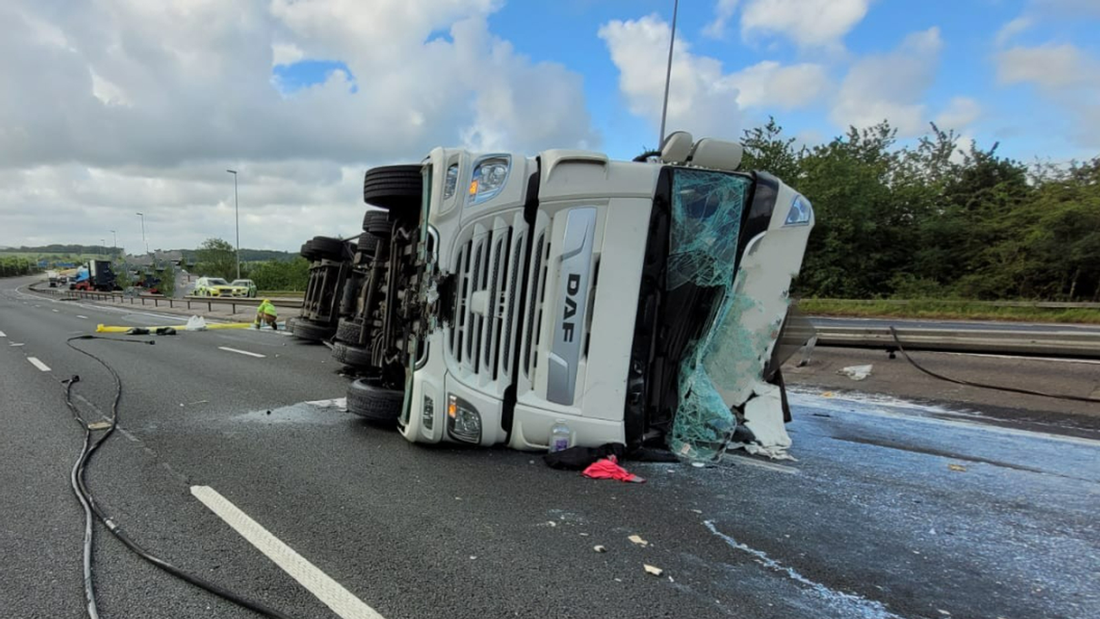 M6 crash: Motorway shut as 20,000 litres of milk spilled after tanker overturns