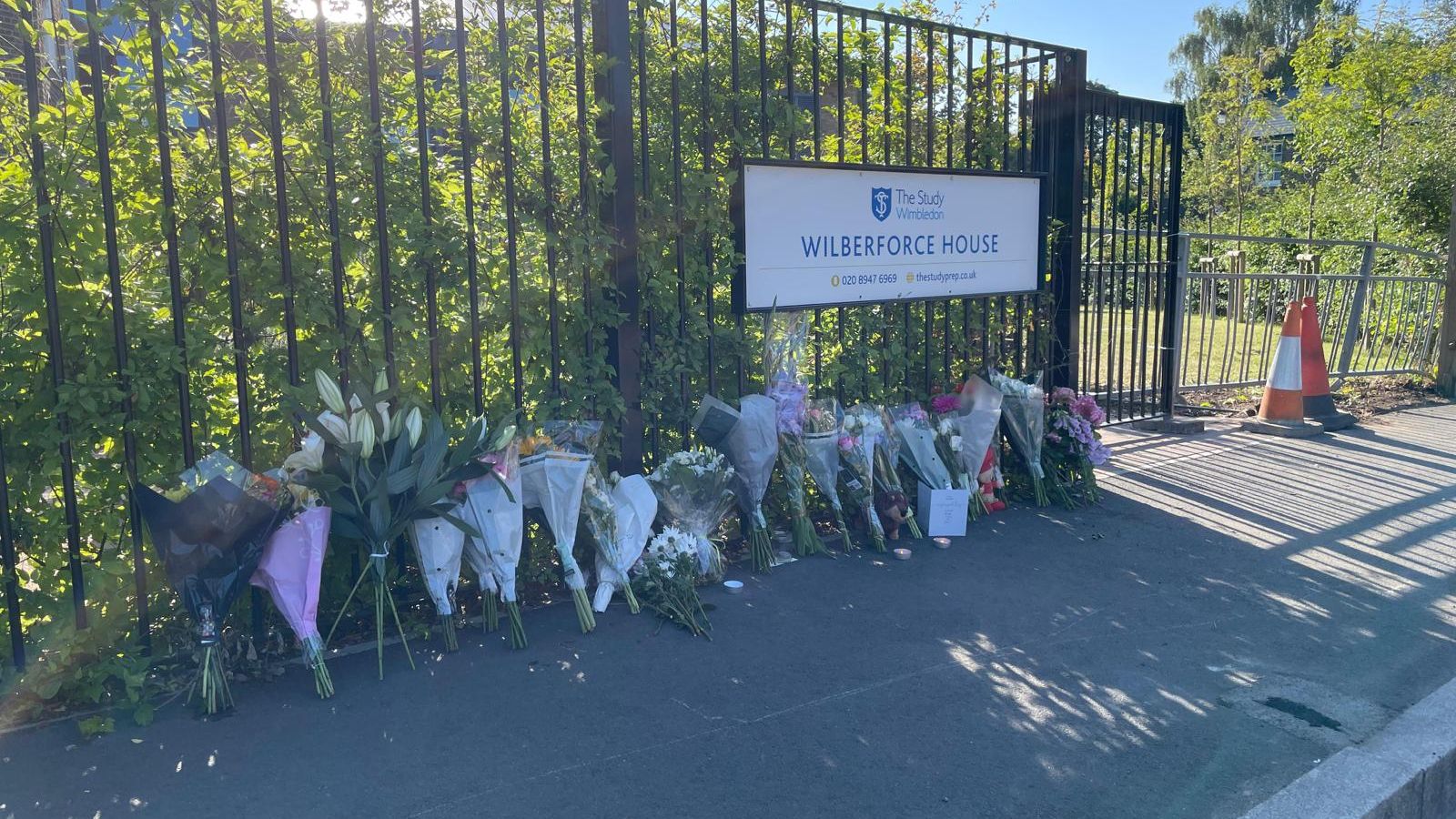 Police continue to question woman as tributes left to girl, 8, killed in Wimbledon school party crash