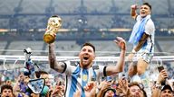Lionel Messi (C) celebrates while holding the trophy, following Argentina&#39;s penalty shootout win over France in the World Cup football final at Lusail Stadium in Lusail, Qatar, on Dec. 18, 2022. (Kyodo via AP Images) ==Kyodo