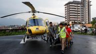 A body of one of the victims is taken to a Nepal hospital