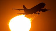 03 April 2023, Hesse, Frankfurt/Main: A passenger plane takes off from Frankfurt Airport in front of the setting sun. Pic: AP