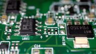 Semiconductor chips are seen on a printed circuit board in this illustration picture taken February 17, 2023. REUTERS/Florence Lo/Illustration
