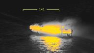 A thermal camera shows the cargo ship Fremantle Highway, on fire at sea 
Pic:Coastguard Netherlands//Reuters