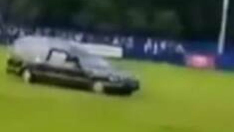 hearse drives onto pitch
