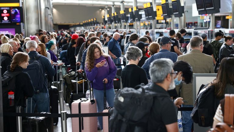 Passengers queue inside the departures terminal of Terminal 2 at Heathrow Airport in London, Britain, June 27, 2022. REUTERS/Henry Nicholls