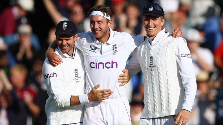 England's Stuart Broad celebrates with James Anderson and Zak Crawley after taking the wicket of Australia's Alex Carey 