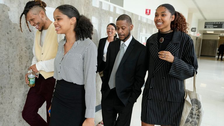 Kecalf Franklin, son of music superstar Aretha Franklin leaves a court hearing with his son Jordan, from left, daughter Grace, wife Kafi and daughter Victorie, Tuesday, July 11, 2023, in Pontiac, Mich. A document handwritten by singer Aretha Franklin and found in her couch after her 2018 death is a valid Michigan will, a jury said Tuesday, a critical turn in a dispute that has turned her sons against each other. (AP Photo/Carlos Osorio)