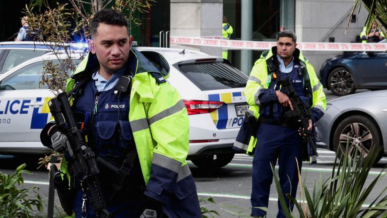 Armed police stand guard near a construction site following a shooting in the central business district, in Auckland, New Zealand July 20, 2023. REUTERS/David Rowland TPX IMAGES OF THE DAY 