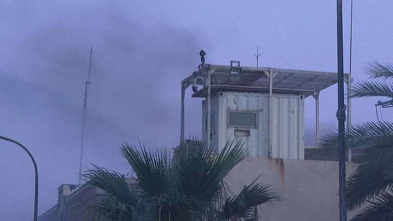Smoke rises from inside the Swedish embassy compound in Baghdad