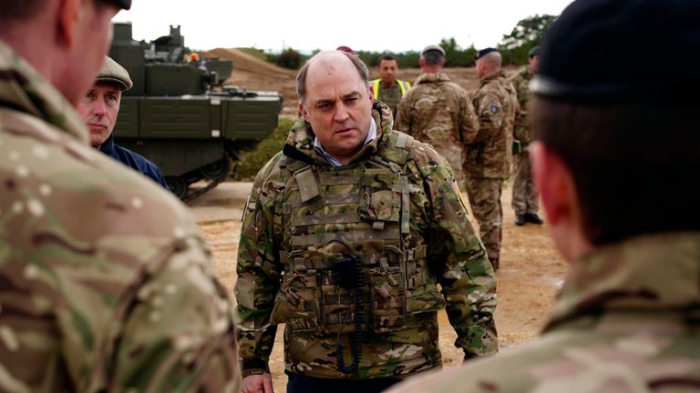 Britain&#39;s Defence Secretary Ben Wallace meets the crew of an Ajax Ares armored personnel carrier during a visit the Bovington Camp, a British Army military base where Ukrainian soldiers are training on Challenger 2 tanks, in Dorset, England, Wednesday Febr. 22, 2023. (Ben Birchall/Pool via AP)