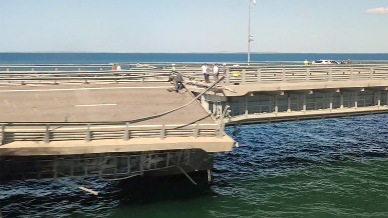 The section of a road split and sloping to one side following an alleged attack on the Crimea Bridge