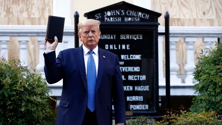 President Donald Trump holds a Bible as he visits outside St. John&#39;s Church across Lafayette Park from the White House Monday, June 1, 2020, in Washington. Part of the church was set on fire during protests on Sunday night. (AP Photo/Patrick Semansky)


