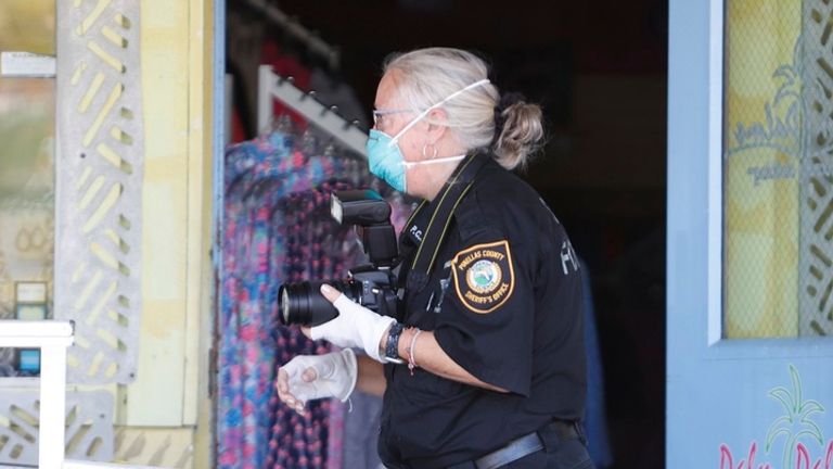 Law enforcement investigate an overnight fire that happened at Alligator and Wildlife Discovery Center on Thursday, July 13, 2023, in Madeira Beach, Fla. (Jefferee Woo/Tampa Bay Times via AP)