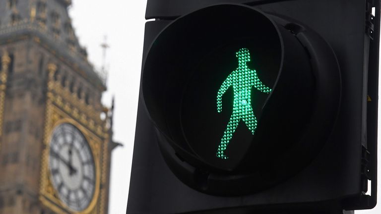 A pedestrian road crossing sign is seen in front of the Big Ben clock tower in London, Britain, January 26, 2017. REUTERS/Toby Melville