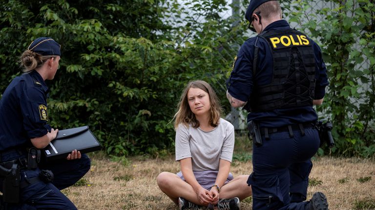 FILE PHOTO: Police talk to Greta Thunberg as they move climate activists from the organization Ta Tillbaka Framtiden, who are blocking the entrance to Oljehamnen in Malmo, Sweden, June 19, 2023. TT News Agency/Johan Nilsson via REUTERS/File Photo
