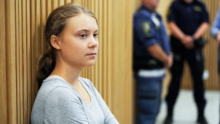 Climate activist Greta Thunberg of Sweden waits for a hearing in a court in Malmo, Sweden, Monday, July 24, 2023. Thunberg appeared in court on Monday charged with disobeying law enforcement in connection with a protest in Malmo in southern Sweden last month. (AP Photo/Pavel Golovkin)