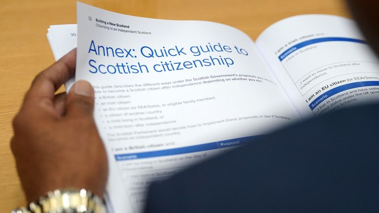 A person reads a policy paper on citizenship in an independent Scotland at its launch by First Minister Humza Yousaf, at the National Records Of Scotland in Edinburgh. Picture date: Thursday July 27, 2023.