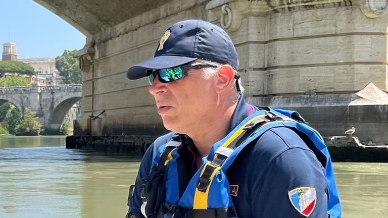 Gianluca Borsari from the Rome River department of the National Police shows how the River Tiber has dropped several metres