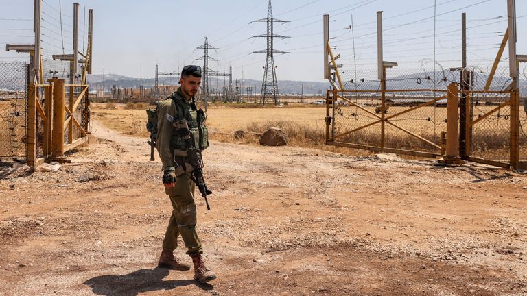 An Israeli soldier stands guard at Salem checkpoint, the entrance from Israel to Jenin 