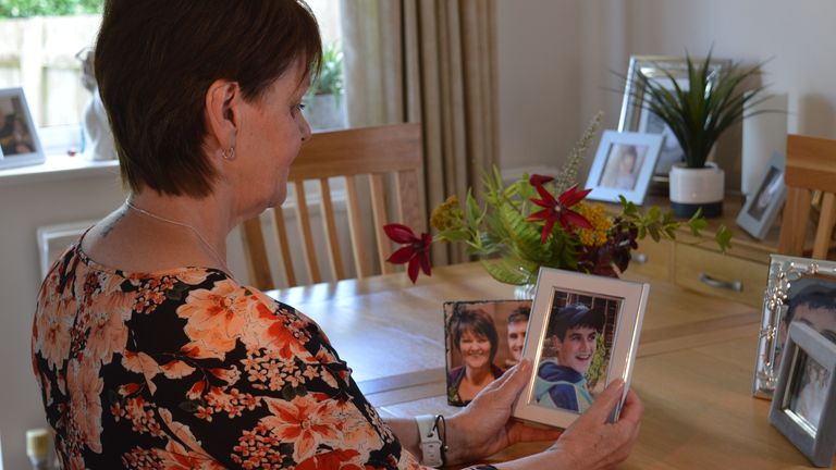 Karen Johnson holding photo of Kane