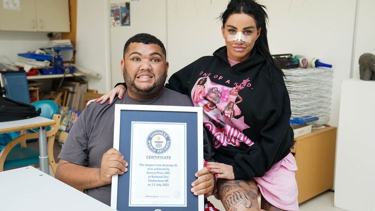 Katie Price and her son Harvey, after he was presented with the Guinness World Record for the longest drawing of a train. Picture date: Thursday July 13, 2023.