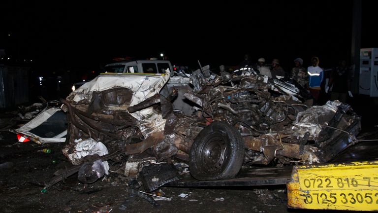 The wreckage of vehicles lies on the ground after a fatal accident in Londiani, Kenya early Saturday, July 1, 2023, at a location known for crashes about 200 kilometers (125 miles) northwest of the capital, Nairobi. Dozens were killed when a truck rammed into several other vehicles and market traders on Friday evening, police said. (AP Photo)