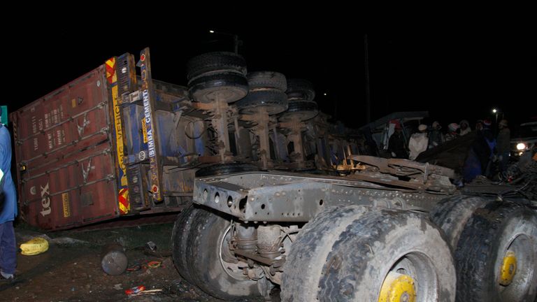 The wreckage of vehicles lies on the ground after a fatal accident in Londiani, Kenya early Saturday, July 1, 2023, at a location known for crashes about 200 kilometers (125 miles) northwest of the capital, Nairobi. Dozens were killed when a truck rammed into several other vehicles and market traders on Friday evening, police said. (AP Photo)