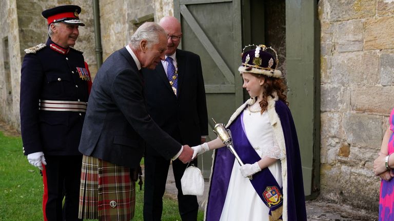 King Charles III greets the Bo&#39;ness Fair Queen, Lexi Scotland, during his visit to Kinneil House marking the first Holyrood Week since his coronation in Edinburgh, Scotland, Britain July 3, 2023. Andrew Milligan/Pool via REUTERS
