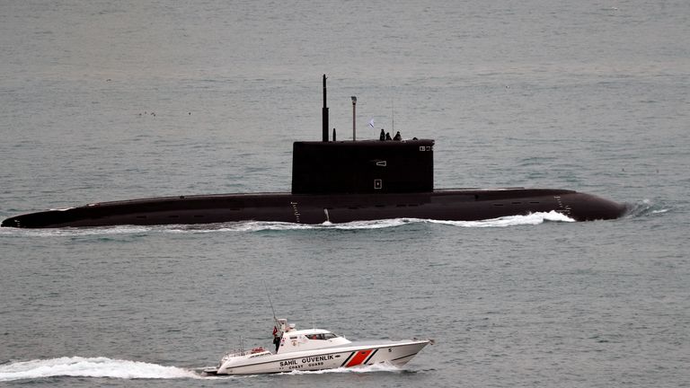 FILE PHOTO: A Turkish Coast Guard boat escorts Russian Kilo-class diesel-electric submarine Krasnodar as it sails in the Bosphorus, on its way to the Mediterranean Sea, in Istanbul, Turkey, March 14, 2019.