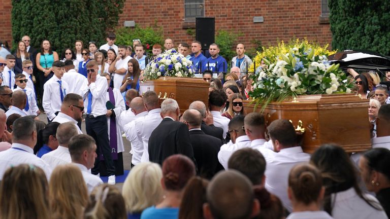 The coffins of Kyrees Sullivan and Harvey Evans are carried into the Church of the Resurrection in Ely, Cardiff. Kyrees, 16, and Harvey, 15, died in road traffic accident in the town on May 22, moments after they had been involved in a pursuit with police whilst riding an electric bike. Picture date: Thursday July 6, 2023.