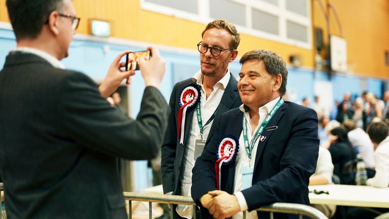 Laurence Fox (centre) of the Reclaim Party poses for a photograph at Queensmead Sports Centre in South Ruislip, west London as ballots are counted in the Uxbridge and South Ruislip by-election, called following the resignation of former prime minister Boris Johnson. Picture date: Friday July 21, 2023. PA Photo. See PA story POLITICS ByElections. Photo credit should read: Jordan Pettitt/PA Wire