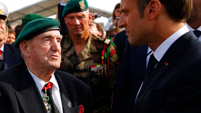 French President Emmanuel Macron, right, listens to French war veteran Leon Gautier, a member of the Kieffer commando, during a ceremony to pay homage to the Kieffer commando, Thursday, June 6, 2019 in Colleville-Montgomery, Normandy. The Kieffer commando, an elite French unit, was among the first waves of Allied troops to storm the heavily defended beaches of Nazi-occupied northern France, beginning the liberation of western Europe. (AP Photo/Francois Mori, Pool)