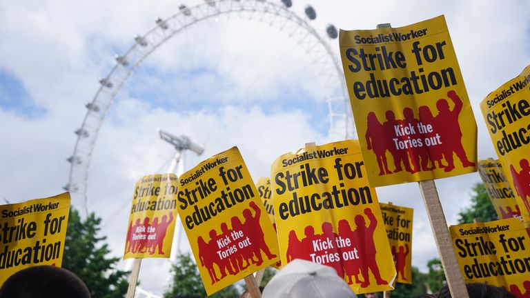 People gathering by the London Eye to take part in a rally through Westminster to Parliament Square, London, as teachers stage walkouts across England in an ongoing dispute over pay. Picture date: Wednesday July 5, 2023.