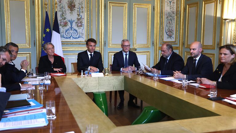 President Emmanuel Macron, center, chairs a government emergency meeting. Pic:AP