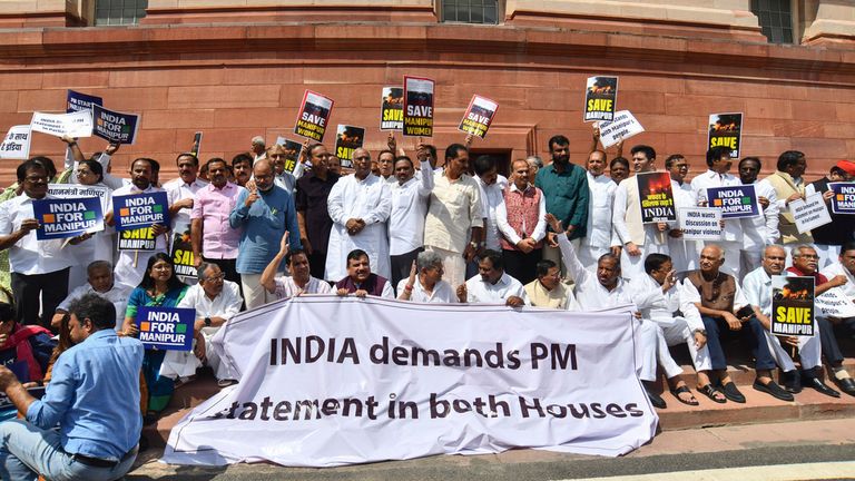 Opposition lawmakers demanding a statement from Prime Minister Narendra Modi on the violence in Manipur state carry placards and chant slogans outside the Parliament building in New Delhi, India, Monday, July 24, 2023. India's Parliament was disrupted for a third day Monday by opposition protests over ethnic clashes in the remote north-eastern state in which more than 130 people have been killed since May. (AP Photo)